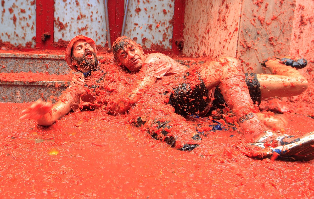 Revelers enjoy as they throw tomatoes at each other, during the annual "Tomatina", tomato fight fiesta, in the village of Bunol, 50 kilometers outside Valencia, Spain, Wednesday, Aug. 30, 20 ...