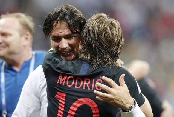 Croatia&#039;s Luka Modric celebrates with head coach Zlatko Dalic after advancing to the final during the semifinal match between Croatia and England at the 2018 soccer World Cup in the Luzhniki Stad ...