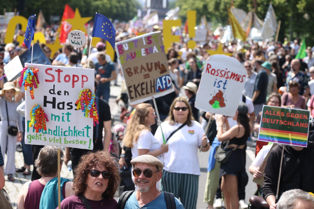 epa11397508 Participants demonstrate with placards during' Stop right-wing extremism - defend democracy' demonstration in Berlin, Germany, 08 June 2024. A broad alliance of various groups ca ...