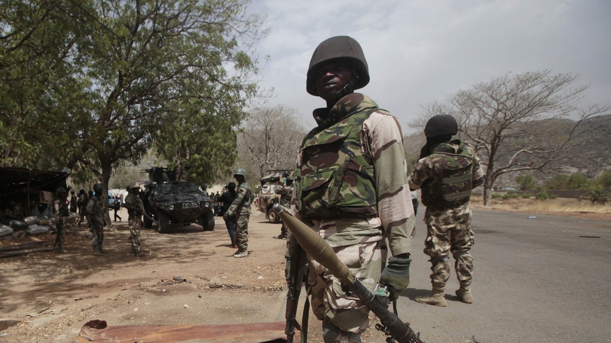 FILE - In this Wednesday April 8, 2015 file photo, Nigerian soldiers man a checkpoint in Gwoza, Nigeria. The Boko Haram extremist group has finally been crushed — driven from its last forest enclave w ...