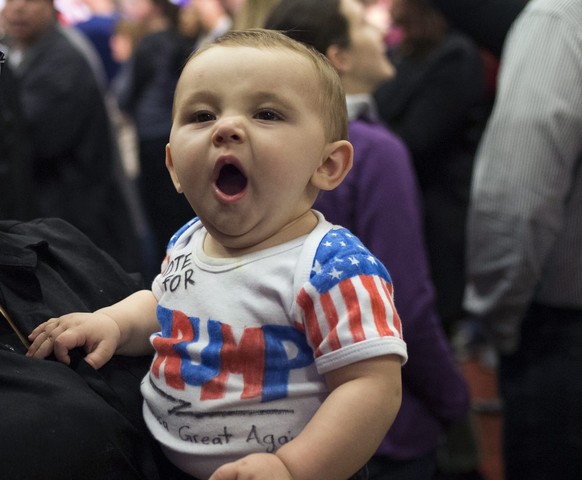 epa05139160 Hayley Kibbe with her eight-month-old baby Beau arrive to support US Republican presidential candidate Donald Trump at the Sheraton in West Des Moines, Iowa, USA, 01 February 2016. Republican presidential hopeful and Texas Senator Ted Cruz comes out on top over billionaire Donald Trump in the first contest of the US presidential nominating contest, results show. The Iowa Caucus is the first official test of candidates seeing their parties' nominations. EPA/JOHN TAGGART