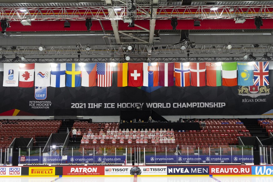 epa09792592 (FILE) - The flag of Belarus (4th right) is displayed next to national flags of other participants at the Olympic Sports Centre, during the IIHF 2021 World Championship, in Riga, Latvia, 2 ...