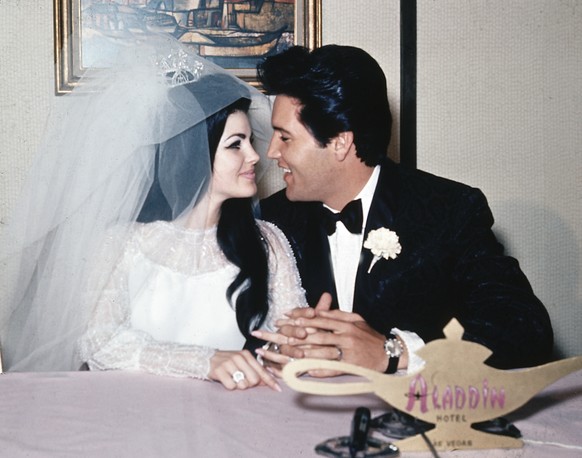 FILE - In this May 1, 1967, file photo, singer Elvis Presley and his bride, the former Priscilla Beaulieu, appear at the Aladdin Hotel in Las Vegas, after their wedding. Priscilla Presley opened up ab ...