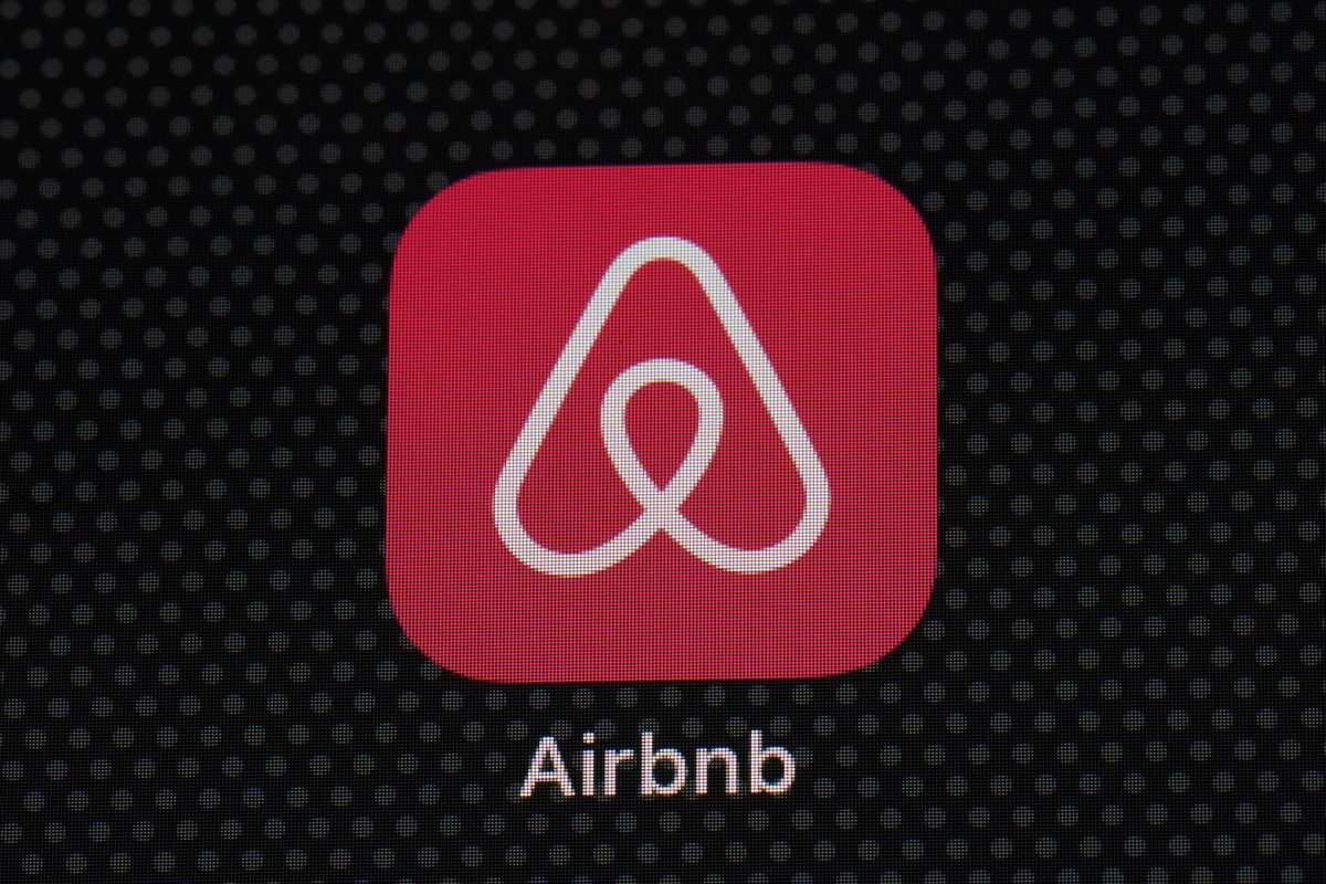 FILE - The Airbnb app icon is displayed on an iPad screen in Washington, D.C., on May 8, 2021. Airbnb says it?s banning the use of indoor security cameras in listings around the world by the end of ne ...