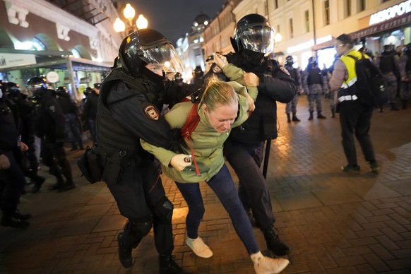 Riot police detain a demonstrator during a protest against mobilization, in Moscow, Russia, Wednesday, Sept. 21, 2022. Russian President Vladimir Putin has ordered a partial mobilization of reservists ...