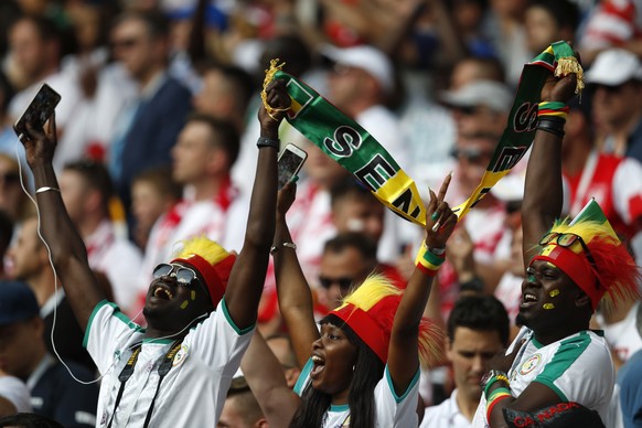 Senegal soccer fans sing their national anthem prior to the start of the group H match between Poland and Senegal at the 2018 soccer World Cup in the Spartak Stadium in Moscow, Russia, Tuesday, June 1 ...