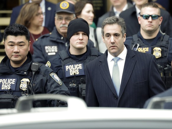 epa07226489 Michael Cohen (front -R), President Trump&#039;s former lawyer, departs United States Federal Court after being sentenced to three years in prison in New York, New York, USA, 12 December 2 ...