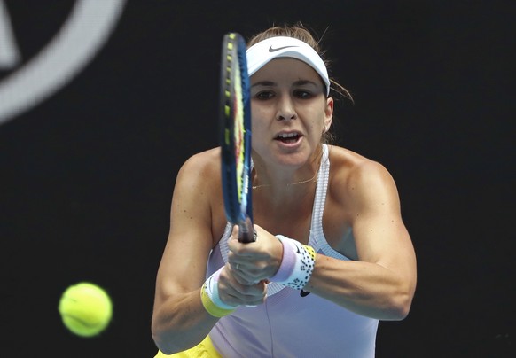 Switzerland&#039;s Belinda Bencic makes a backhand return to Slovakia&#039;s Anna Karolina Schmiedlova during their first round singles match at the Australian Open tennis championship in Melbourne, A ...