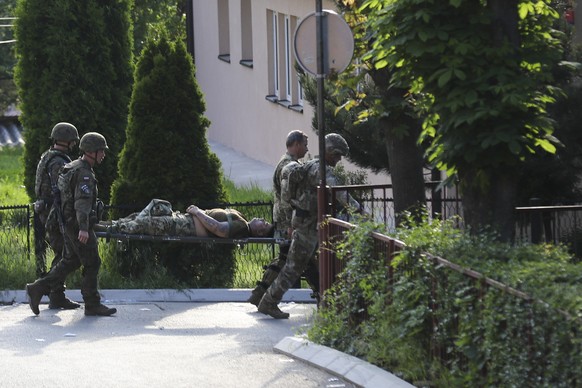 A KFOR soldier is carried on a stretcher after suffering an injury during clashes with Kosovo Serbs in the town of Zvecan, northern Kosovo, Monday, May 29, 2023. Ethnic Serbs in northern Kosovo clashe ...