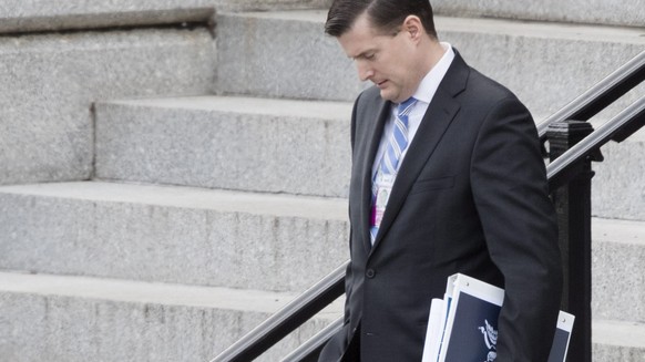 epa05715974 Trump transition team member Rob Porter walks outside the Eisenhower Executive Office Building following meetings, at the White House complex in Washington, DC, USA, 13 January 2017. Senio ...