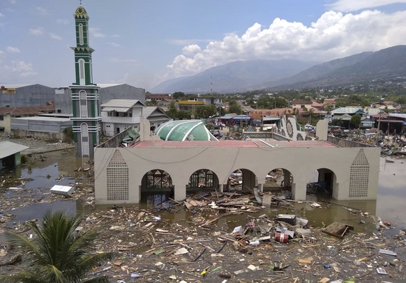 The ruin of a mosque badly damaged by earthquake and tsunami is seen in Palu, Central Sulawesi, Indonesia, Saturday, Sept. 29, 2018. The powerful earthquake rocked the Indonesian island of Sulawesi on ...