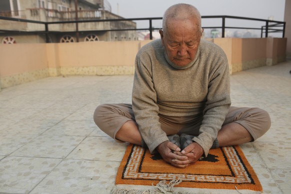 Nepalese mountain climber Min Bahadur Sherchan, does his morning Yoga at his residence in Kathmandu, Nepal, Wednesday, April 12, 2017. The 85-year-old climber who was once the oldest person to scale t ...