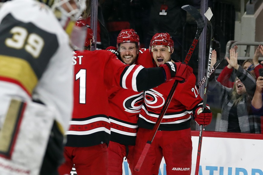 Carolina Hurricanes&#039; Nino Niederreiter (21) celebrates his goal with teammate Brendan Smith (7) during the second period of an NHL hockey game against the Vegas Golden Knights in Raleigh, N.C., T ...