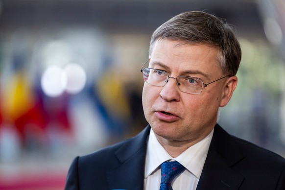 European Commissioner for Economy and Productivity, Implementation and Simplification Valdis Dombrovskis speaks with the media as he arrives for a meeting of eurozone finance ministers at the European ...