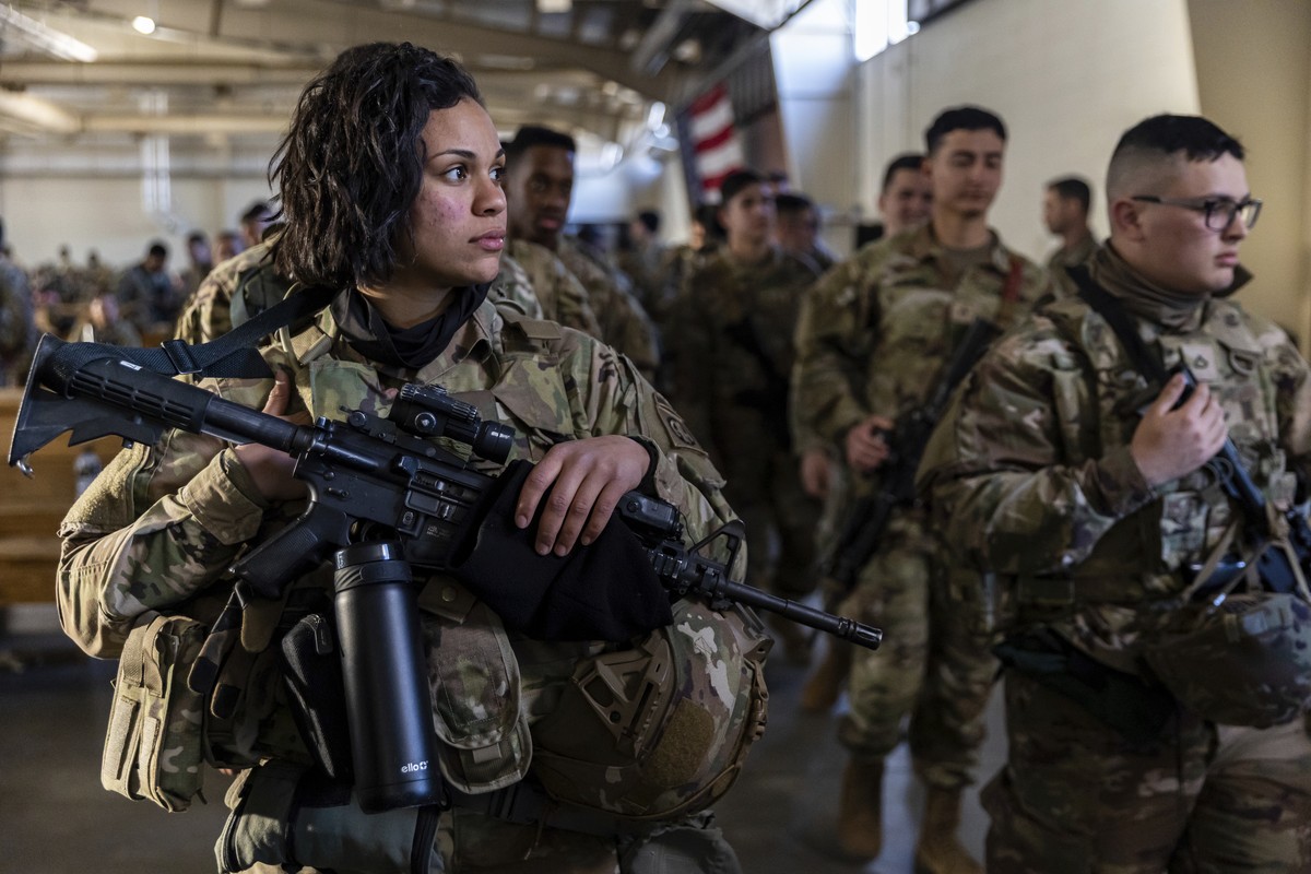 Members of the 82nd Airborne Division of the U.S. Army prepare for deployment to Poland from Fort Bragg, N.C. on Monday, Feb. 14, 2022. They are among soldiers the Department of Defense is sending in  ...