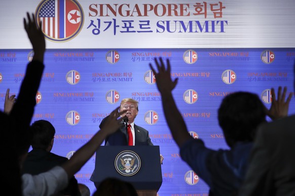 U.S. President Donald Trump answers questions about the summit with North Korea leader Kim Jong Un during a press conference at the Capella resort on Sentosa Island Tuesday, June 12, 2018 in Singapore ...