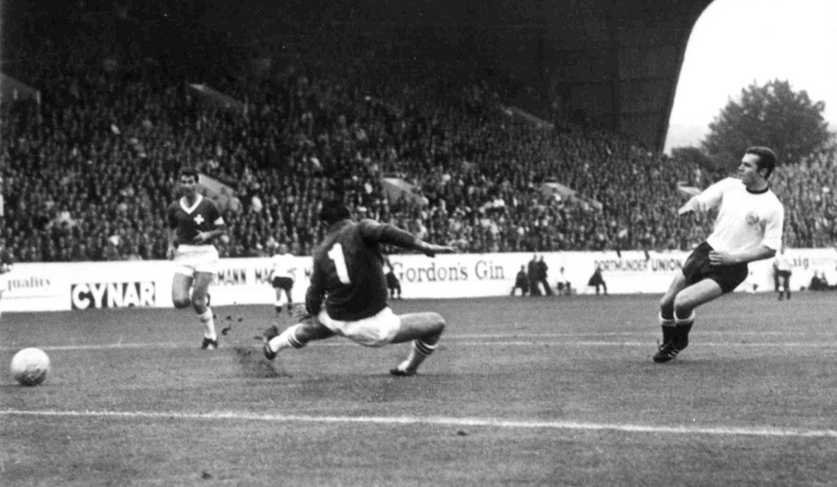 West Germany's Franz Beckenbauer, right, scores his teams fourth goal against Switzerland in the Football World Cup match at Hillsborough Stadium, Sheffield, on July 12, 1966. Swiss goalkeeper Ch ...