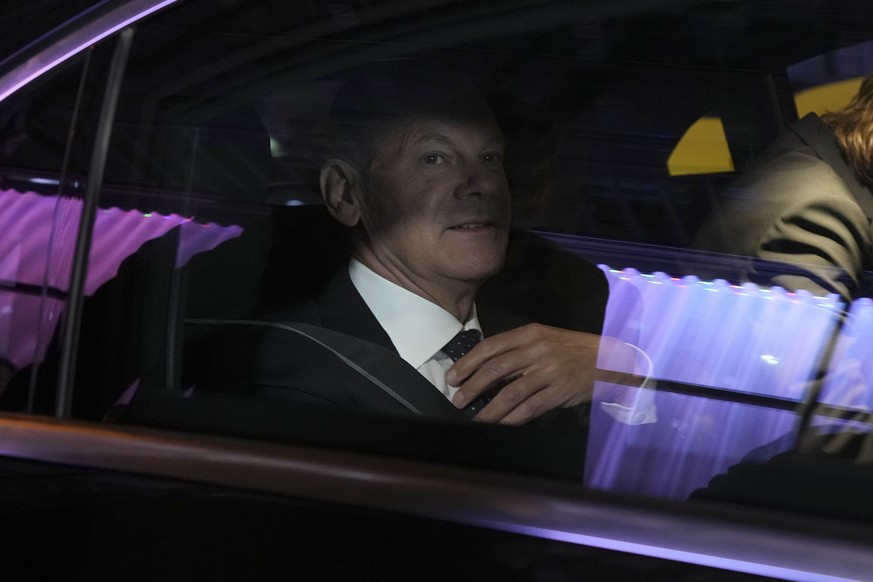 Olaf Scholz, Finance Minister and SPD candidate for Chancellor, leaves after attending a TV broadcast on the parliamentary elections in Berlin, Sunday, Sept. 26, 2021. Exit polls show the center-left  ...