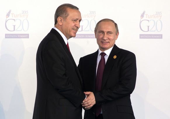 Turkeys President Recep Tayyip Erdogan, left, greets Russias President Vladimir Putin as he arrives for the G-20 Summit in Antalya, Turkey, Sunday, Nov. 15, 2015. (Sergei Guneyev/RIA Novosti, Kremli ...