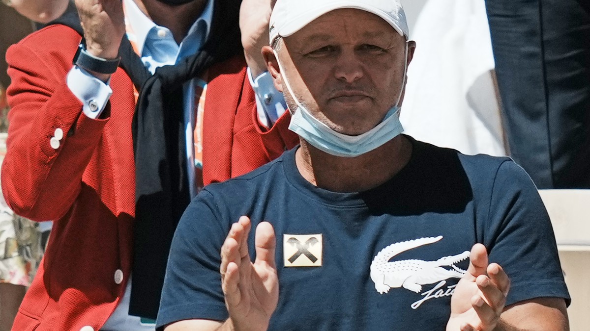 Serbia's Novak Djokovic's coach Marian Vajda applauds as Djokovic plays Stefanos Tsitsipas of Greece during their final match of the French Open tennis tournament at the Roland Garros stadiu ...