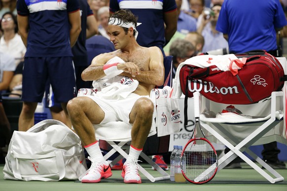Roger Federer, of Switzerland, towels off between sets against Steve Darcis, of Belgium, during the second round of the U.S. Open tennis tournament in New York, Thursday, Sept. 3, 2015. Federer won 6- ...