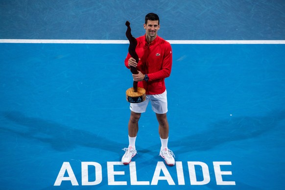 epa10395400 Novak Djokovic of Serbia celebrates victory in his match against Sebastian Korda of the United States during the Mens Singles Final 2023 Adelaide International Tennis Tournament at the Mem ...