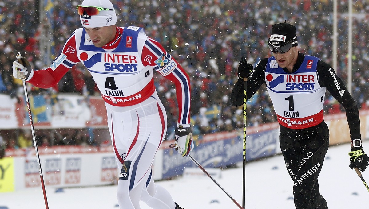 Switzerland's Dario Cologna in action behind Norway's Petter Northug during the men's 50 km classic mass start competition at the 2015 Nordic World Skiing Championships in Falun, Sweden ...