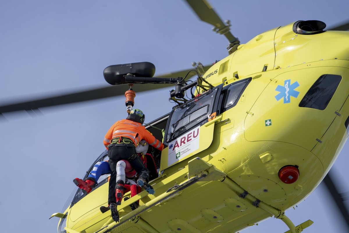 Austria's Marco Schwarz, partially seen at left, is airlifted after crashing during an alpine ski, men's World Cup downhill race, in Bormio, Italy, Thursday, Dec. 28, 2023. Schwarz appeared  ...
