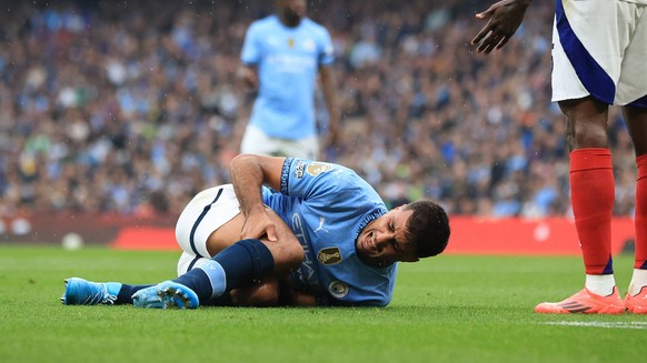 22nd September 2024 Etihad Stadium, Manchester, England Premier League Football, Manchester City versus Arsenal Rodri of Manchester City is injured in a collision with Thomas Party of Arsenal leading  ...