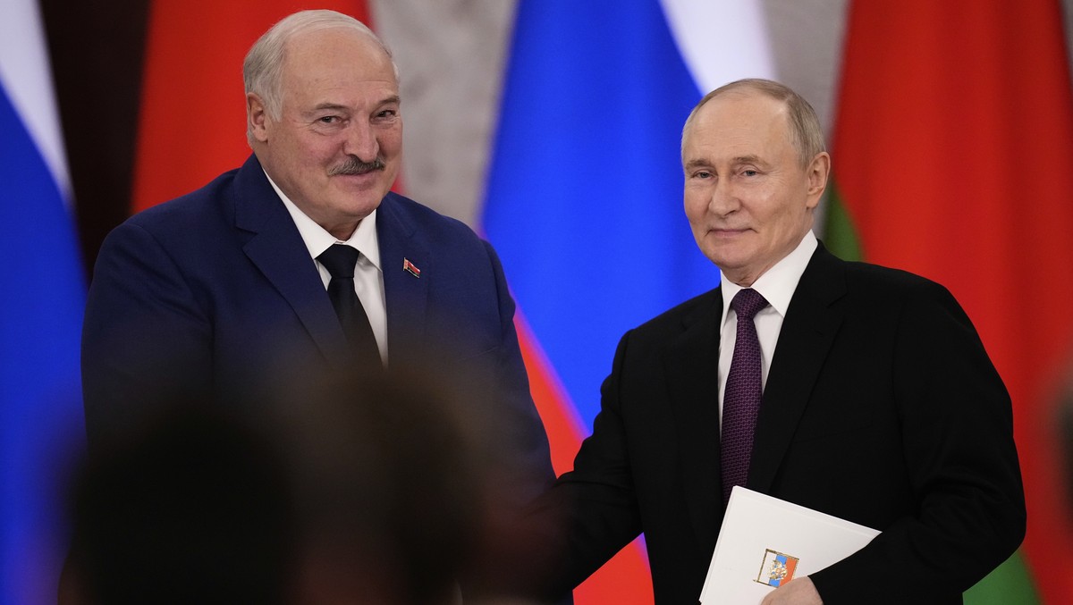 Russian President Vladimir Putin, right, and Belarusian President Alexander Lukashenko shake hands after a signing ceremony following their talks at the Grand Kremlin Palace in Moscow, Russia, Thursda ...