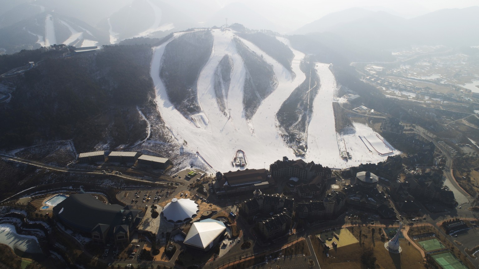 epa07315168 Picture taken with a drone shows buildings of the Alpensia ski resort which hosted the Sliding Center, the Ski Jumping, Biathlon and Cross Country events of the PyeongChang Winter Olympic  ...