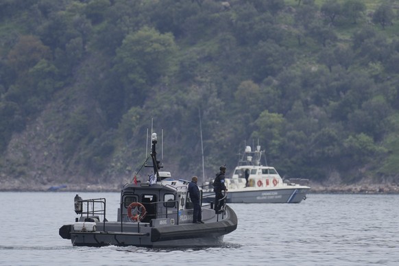 FILE- Frontex, foreground, and Greek coast guard vessels take part in a search and rescue operation, after the capsizing of a boat carrying migrants, off the coast on the northeastern Aegean Sea islan ...