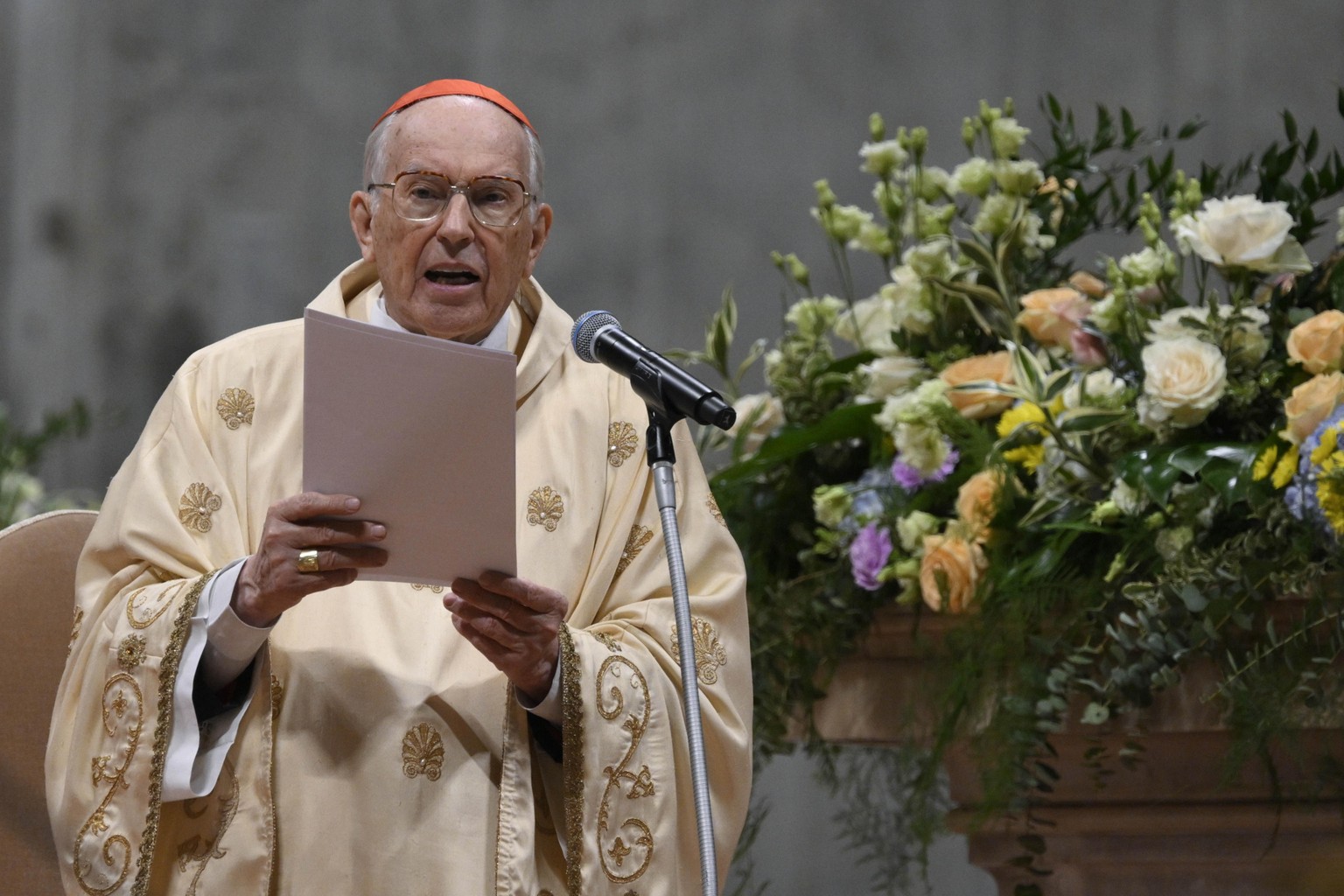epa12041627 A handout picture provided by the Vatican Media shows Cardinal Giovanni Battista Re presides over the Easter Vigil mass in Saint Peter's Basilica, Vatican City, 19 April 2025. EPA/VAT ...