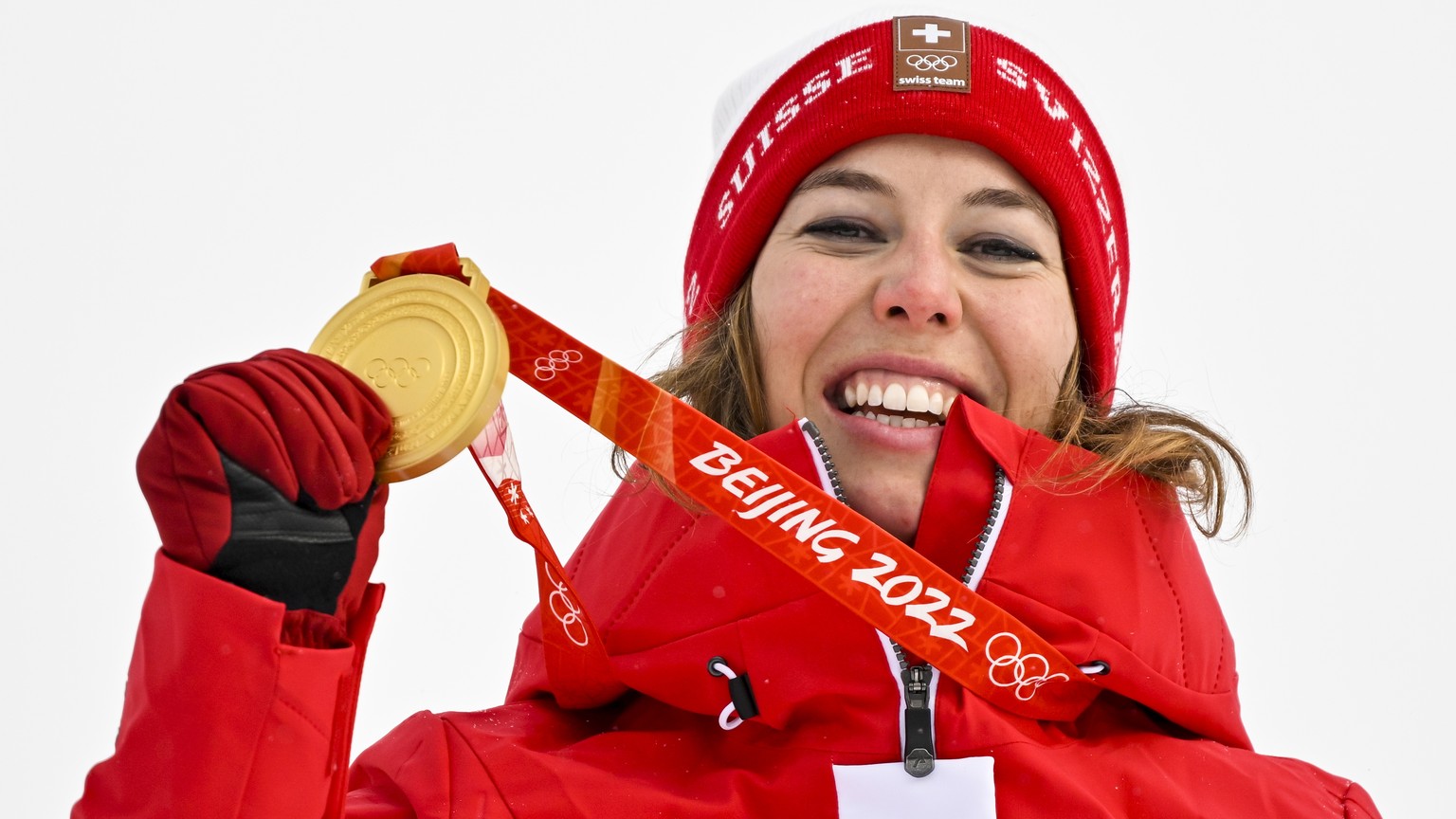 epa09764912 Gold medalist Michelle Gisin of Switzerland celebrates during the victory ceremony of the Women&#039;s Alpine Skiing Combined Slalom race at the Beijing 2022 Olympic Games at the Yanqing N ...