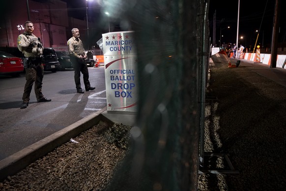 Maricopa County Sheriff&#039;s Deputies stand inside a secured area at the Maricopa County Recorders Office, Tuesday, Nov. 8, 2022, in Phoenix. (AP Photo/Matt York)