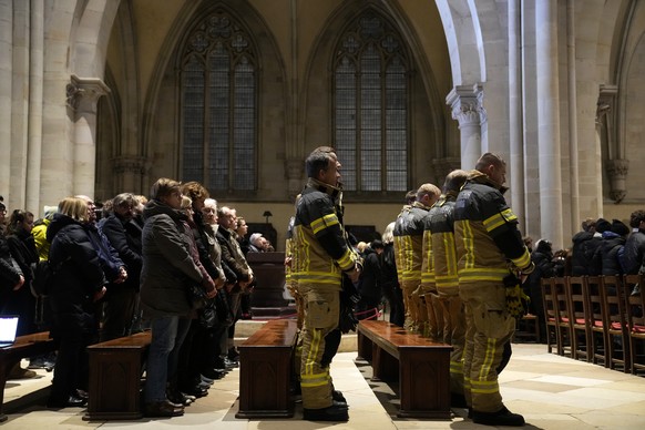 Firefighters attend a memorial service for victims of Friday&#039;s Christmas Market attack, where a car drove into a crowd, in Magdeburg, Germany, Saturday, Dec. 21, 2024. (AP Photo/Ebrahim Noroozi)