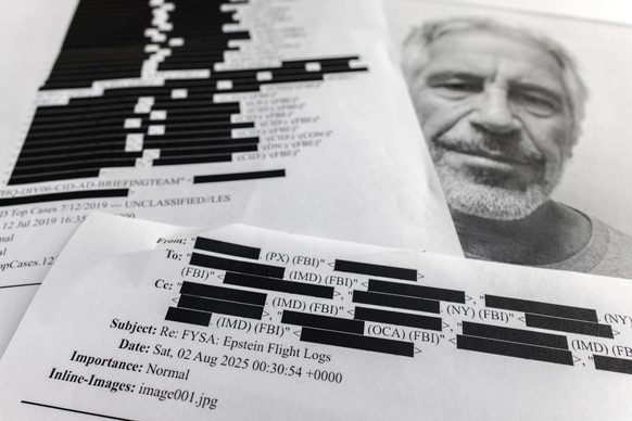 epa12724191 (ILLUSTRATION) - Printed copies of the Jeffrey Epstein files in Miami, Florida, 10 February 2026. According to official charges and court records released under the Epstein Files Transpare ...