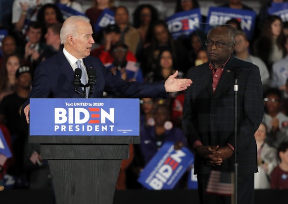 Democratic presidential candidate former Vice President Joe Biden gestures to Rep. James Clyburn, D-S.C., at a primary night election rally in Columbia, S.C., Saturday, Feb. 29, 2020 after winning the ...