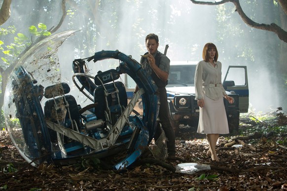 This photo provided by Universal Pictures shows, Chris Pratt, left, and Bryce Dallas Howard in a scene from the film, &quot;Jurassic World,&quot; directed by Colin Trevorrow, in the next installment o ...