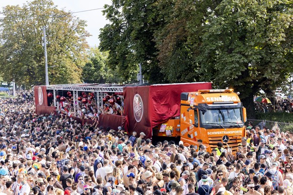epa10797220 Participants attend the 30th Street Parade in the city center of Zurich, Switzerland, 12 August 2023. The annual dance music event Street Parade runs this year under the theme 'I wish ...