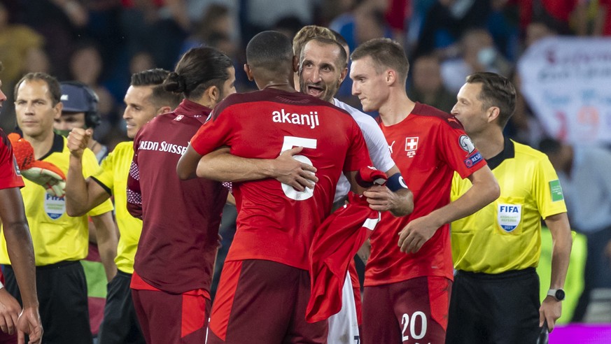 Italy&#039;s Giorgio Chiellini hugs Switzerland&#039;s Manuel Akanji after the 2022 FIFA World Cup European Qualifying Group C match between Switzerland and Italy in the St. Jakob-Park stadium in Base ...