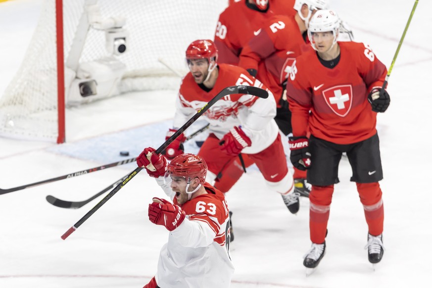 epa09750067 Danish players Patrick Russell (front) and Frans Nielsen (back L) celebrate their team&#039;s 3-1 lead during the Men&#039;s Ice Hockey preliminary round game between Switzerland and Denma ...