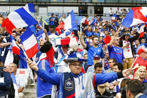epa05355452 French fans cheer for their team before the UEFA EURO 2016 group A preliminary round match between France and Romania at Stade de France in Saint-Denis, France, 10 June 2016.

(RESTRICTI ...