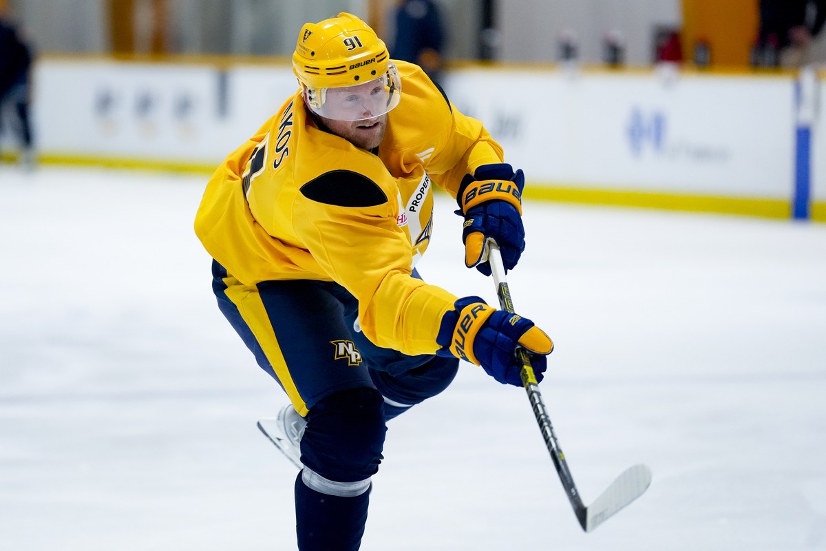 Nashville Predators forward Steven Stamkos (91) shoots the puck during NHL hockey training camp Thursday, Sept. 19, 2024, in Nashville, Tenn. (AP Photo/George Walker IV)