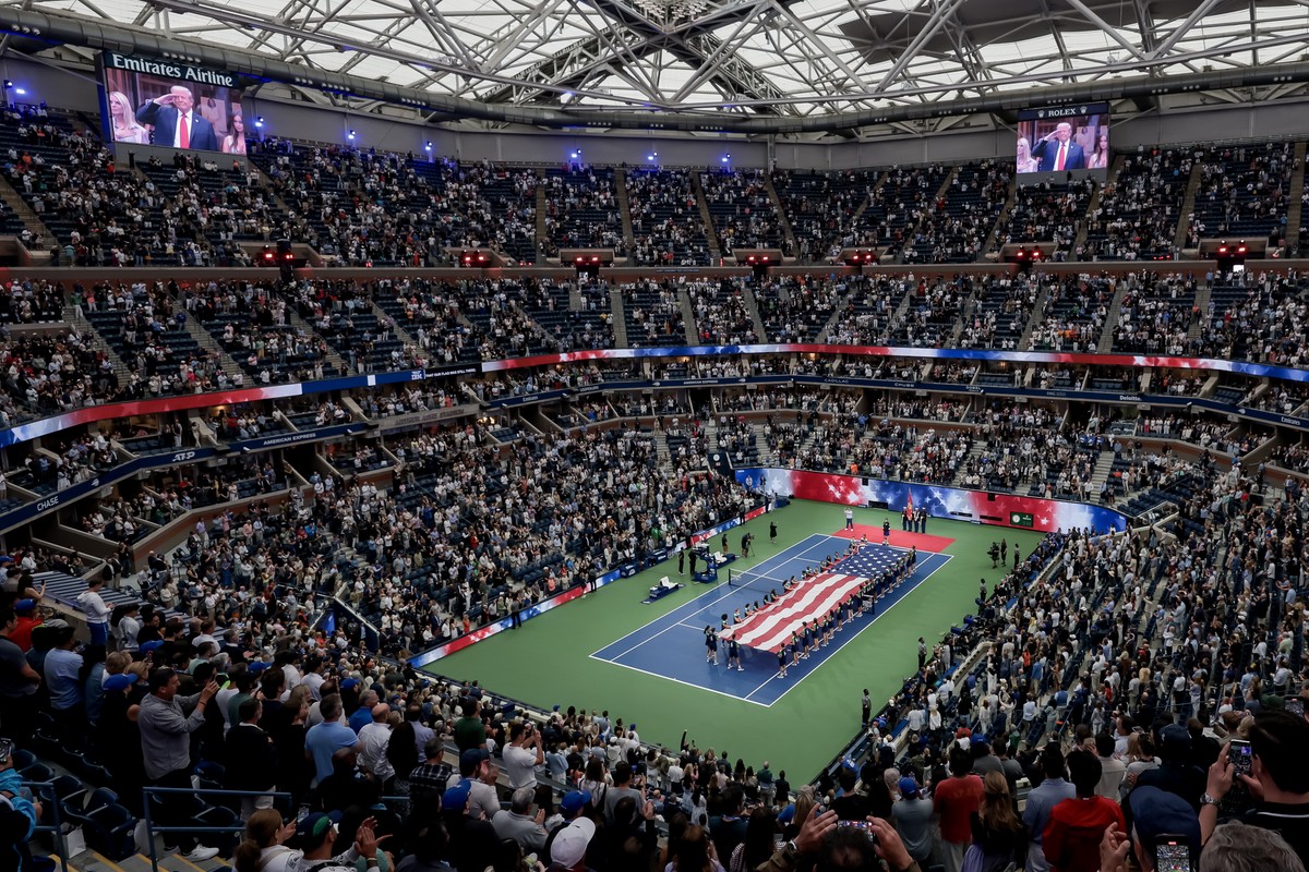 epaselect epa12361280 US President Donald J. Trump is displayed on overhead televisions during prematch ceremonies before Carlos Alcaraz of Spain faces Jannik Sinner of Italy during the men's sin ...