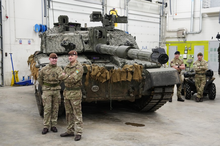 Britain&#039;s military officers stand next to a Challenger 2 tank at the Tapa Military Camp, in Estonia, Thursday, Jan. 19, 2023. Britain&#039;s Defence Minister Ben Wallace said his country would se ...