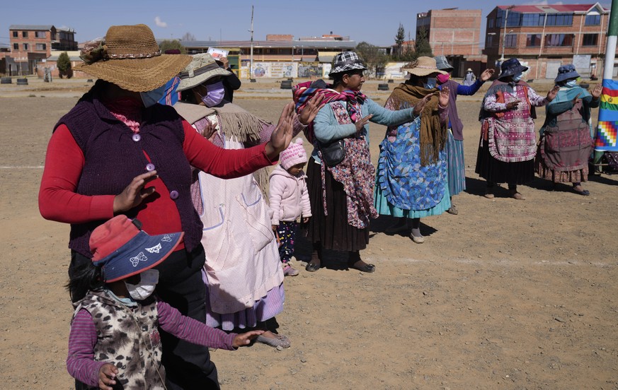 Aymara women listen to taekwondo instructors during a personal defense training session in El Alto, Bolivia, Thursday, July 22, 2021. Taekwondo instructors called &quot;Warmi Power&quot; a mix of Ayma ...