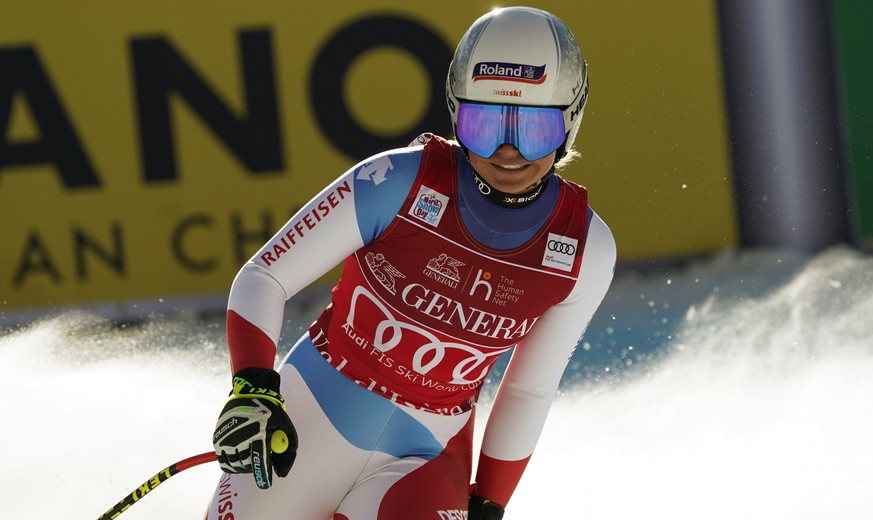Switzerland's Corinne Suter crosses the finish line during an alpine ski, women's World Cup Downhill, in Val d'Isere, France, Friday, Dec.18, 2020. (AP Photo/Giovanni Auletta)