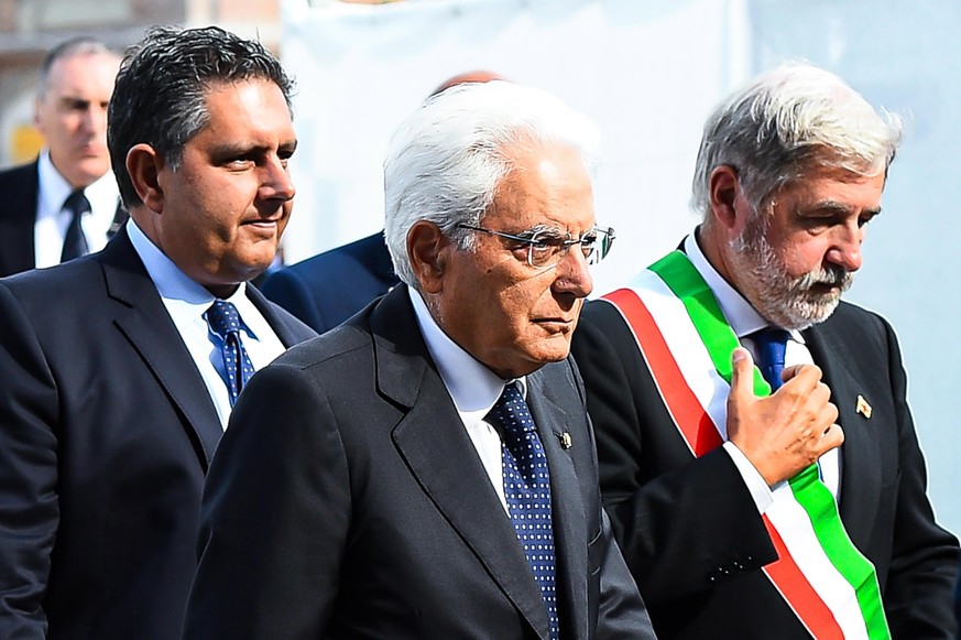 epa07772570 Liguria Region Governor Giovanni Toti (L), Italian President Sergio Mattarella (C) and Genoa Mayor Marco Bucci (R) attend the memorial ceremony for the victims on the first anniversary of  ...