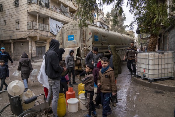 On 10 February 2023, children and families fill jerrycans with clean water at a distribution point in Almyassar neighbourhood, Aleppo city, northern Syrian Arab Republic. 

This is a part of UNICEF’s  ...